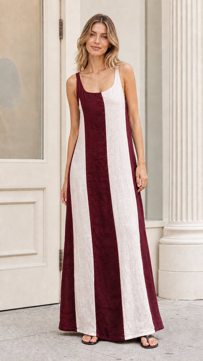 Front view of model wearing burgundy color-blocked maxi dress