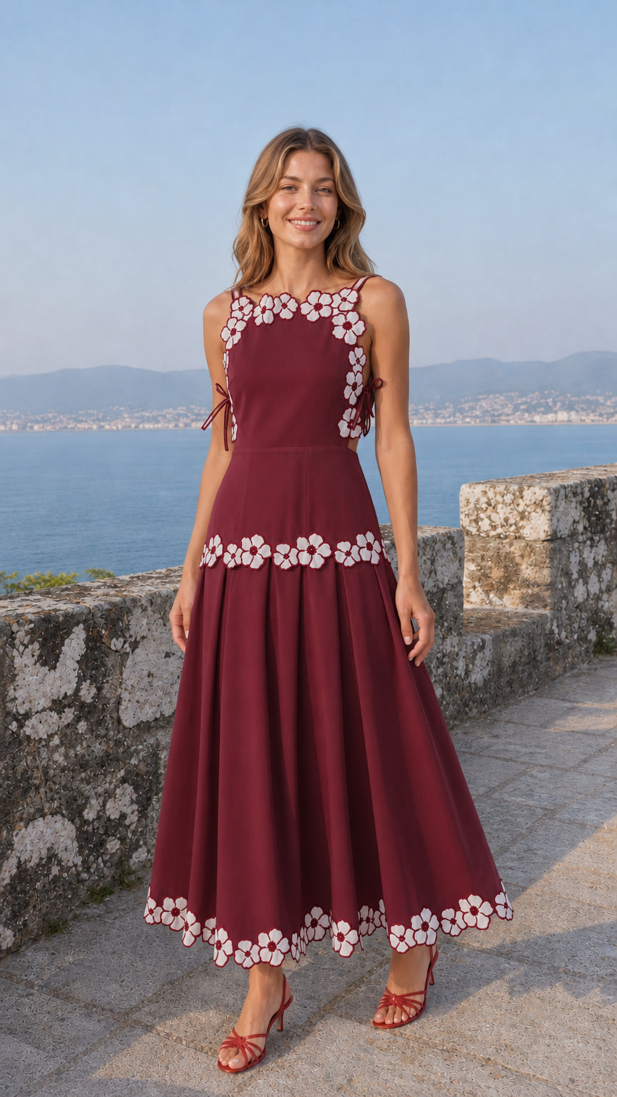 Woman wearing burgundy variant of the embroidered floral midi dress