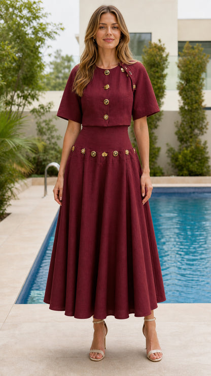 Woman wearing burgundy button-detailed crop top and midi skirt set