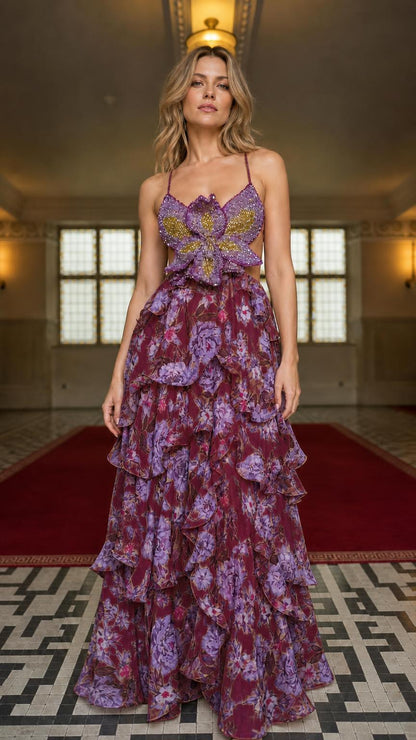 Model wearing burgundy floral ruffle maxi dress with beaded bodice