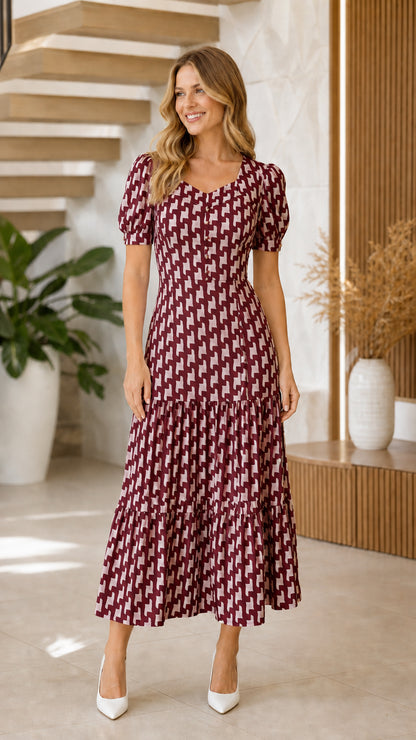 Model wearing burgundy geometric print maxi dress