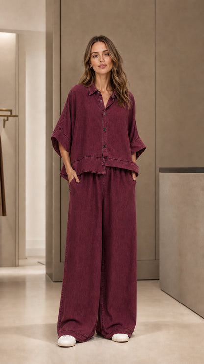 Full front view of model wearing burgundy two-piece pants set