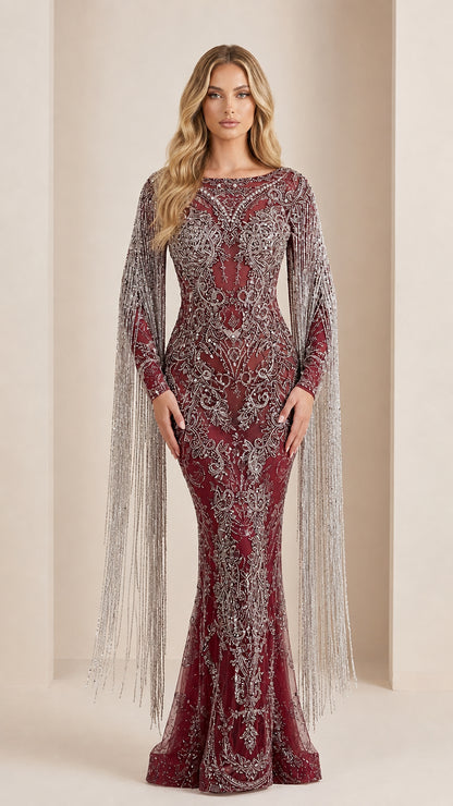 Model wearing burgundy wine red embellished evening dress with beaded fringe sleeves