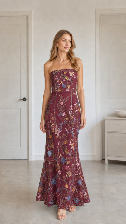 Front view of burgundy floral embroidered strapless maxi dress