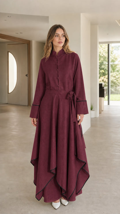 Front view of woman wearing burgundy maxi dress with contrast trim