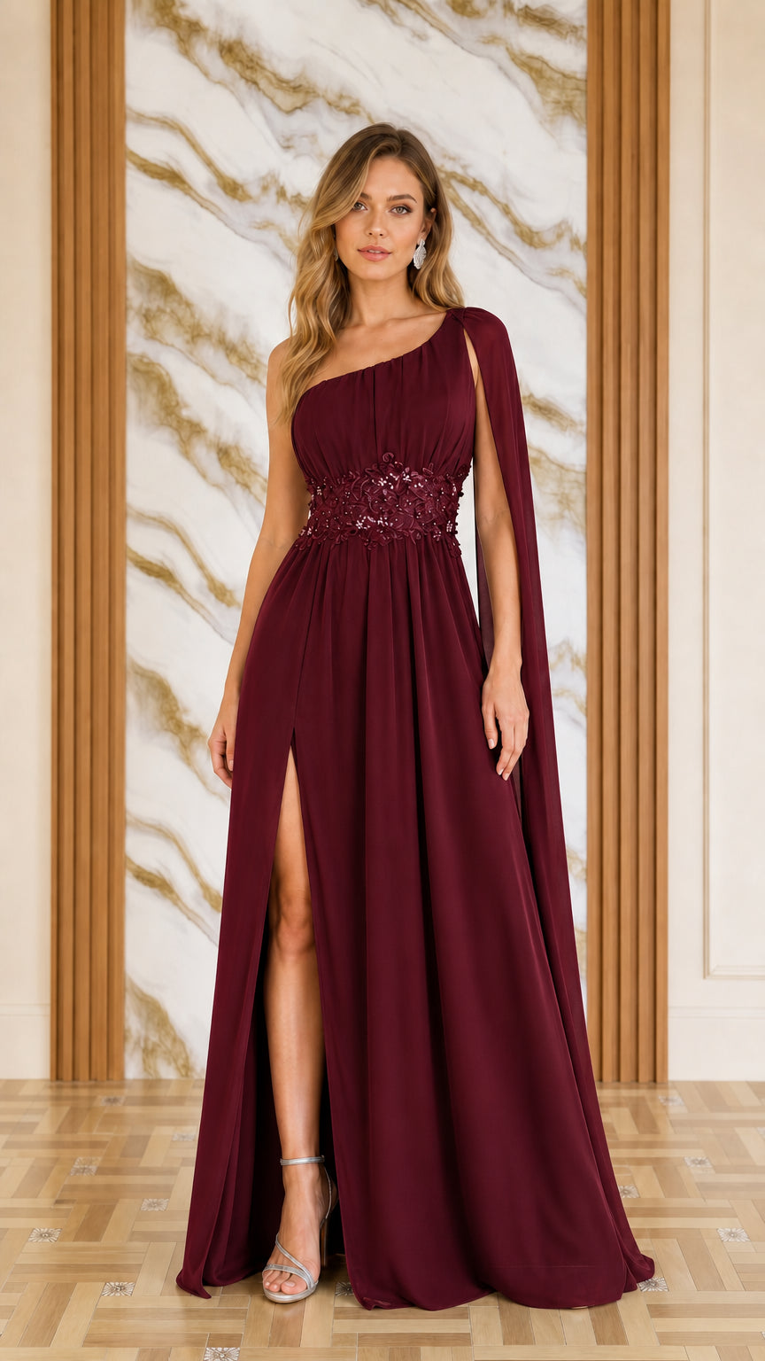Front view of woman wearing burgundy one-shoulder cape evening dress