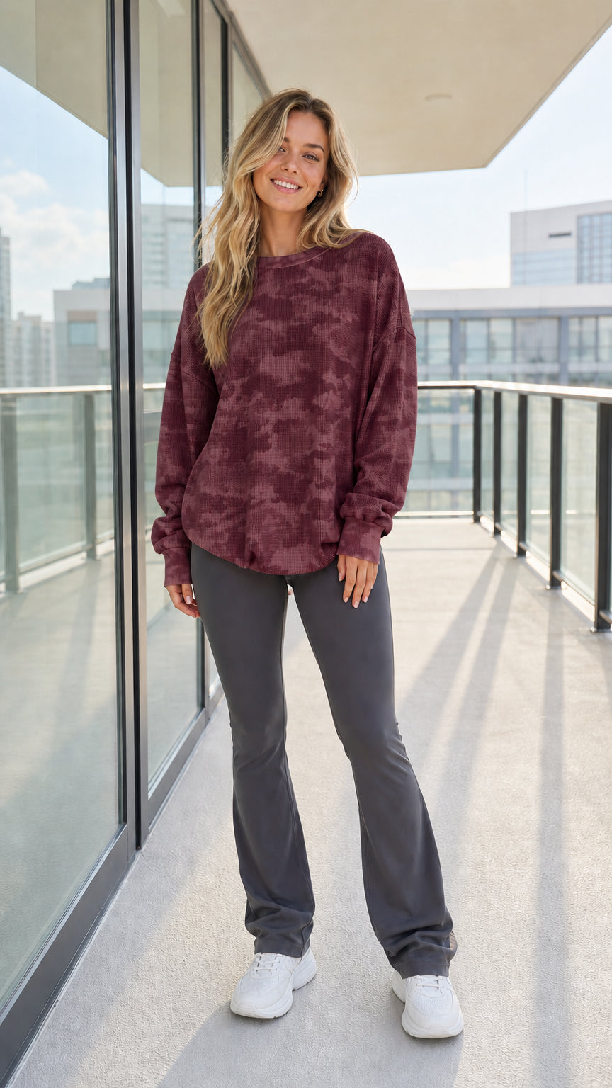 Woman wearing burgundy wine tie-dye waffle knit sweatshirt