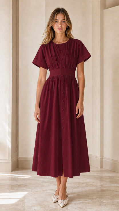 Model wearing burgundy pleated button-down midi dress