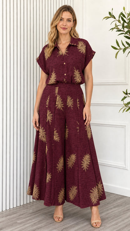 Model wearing burgundy leaf print two piece set