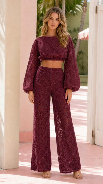 Front view of model wearing burgundy textured lace two-piece set