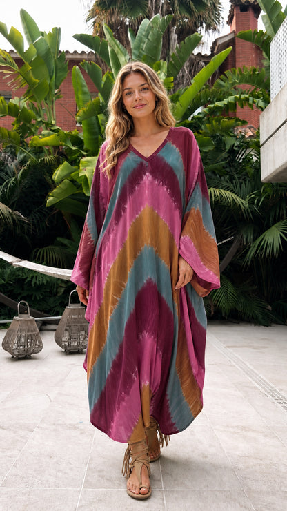 Model wearing burgundy multi tie-dye kaftan dress