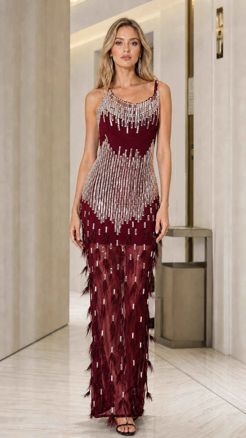 Front view of woman in burgundy sequin and feather gown