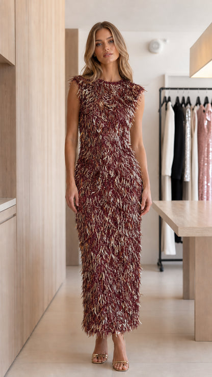 Model wearing burgundy wine red sleeveless fringe sequin column maxi dress front view