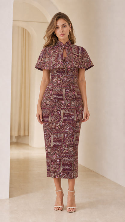 Front view of model wearing Burgundy embroidered jacquard capelet midi dress