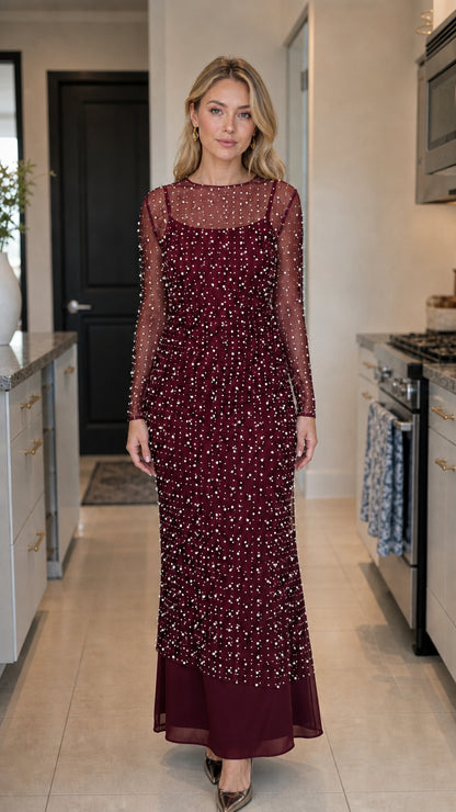Front view of model wearing burgundy pearl maxi dress