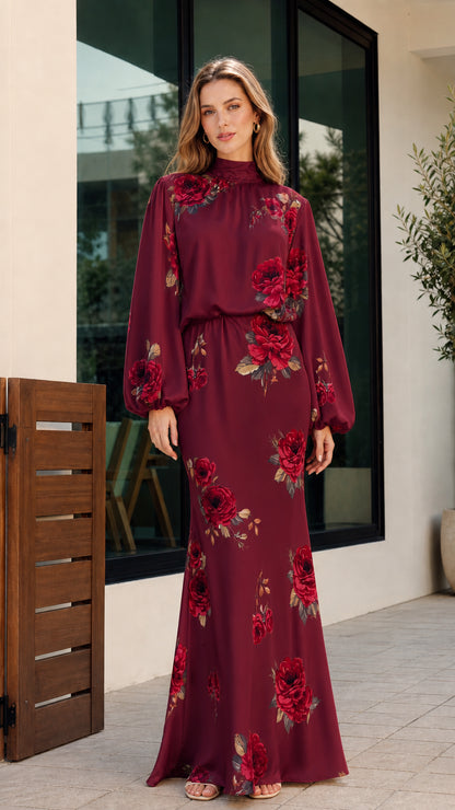 Full-length front view of woman wearing burgundy floral print high-neck long sleeve maxi dress
