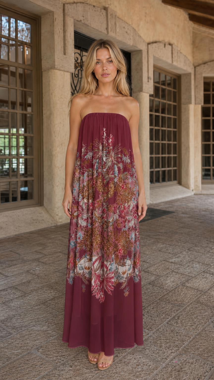 Front view of model wearing burgundy floral strapless maxi dress