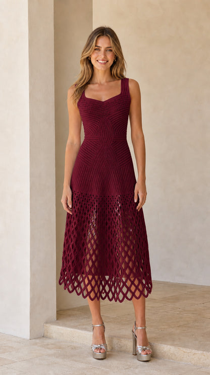Front view of woman wearing burgundy sleeveless knit midi dress