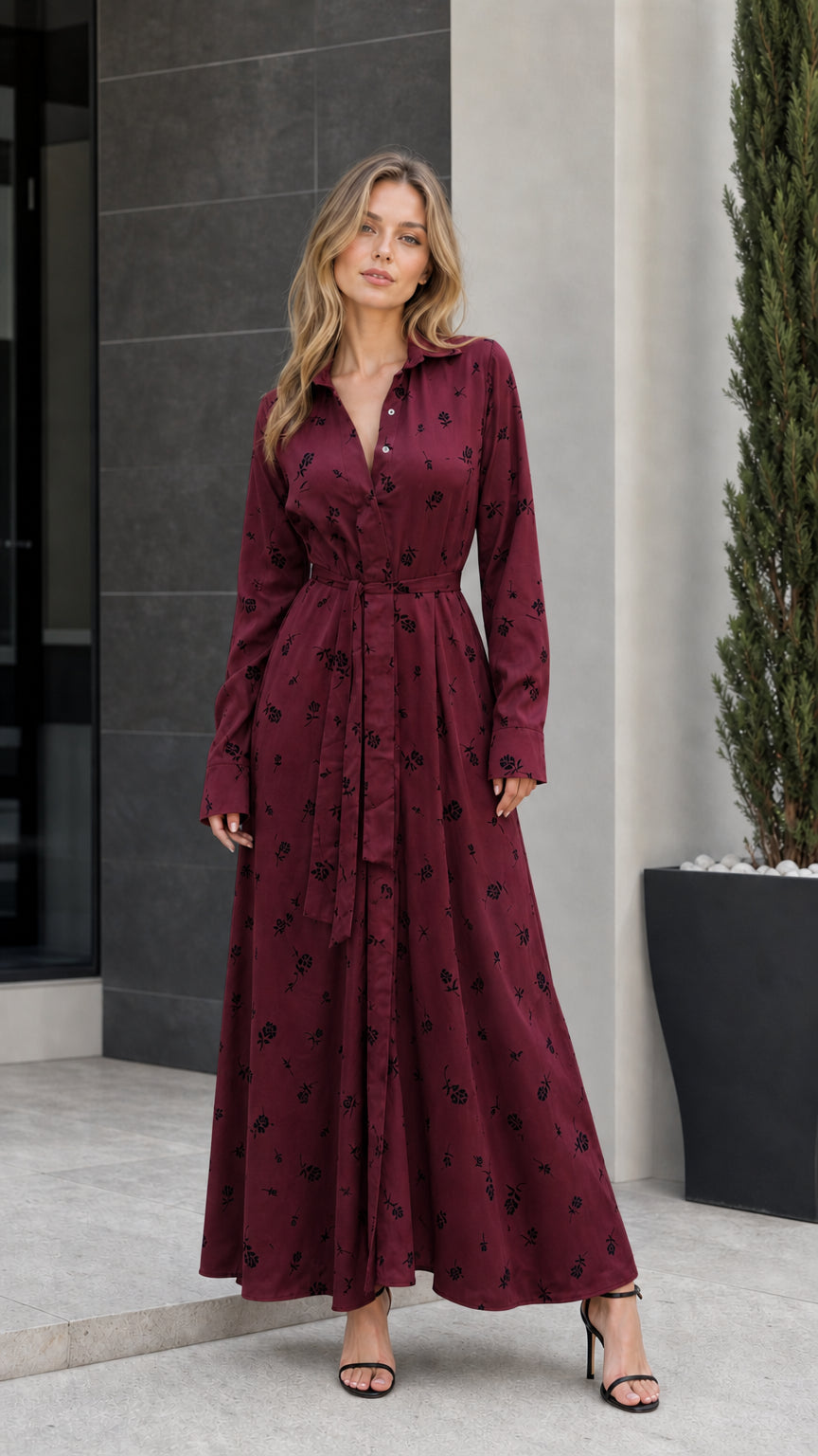 Front view of woman wearing burgundy floral long-sleeve maxi dress