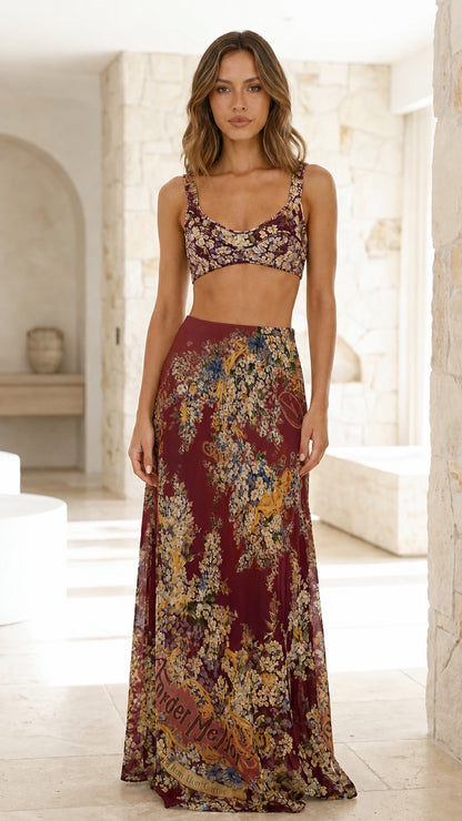 Model wearing burgundy floral crop top and maxi skirt set