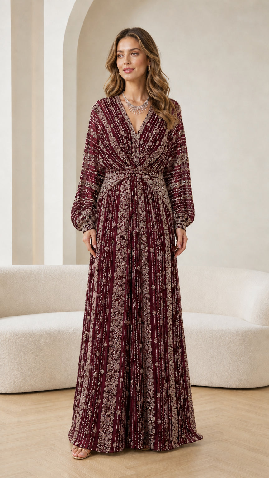 Full-length view of woman modeling burgundy wine beaded long sleeve maxi dress