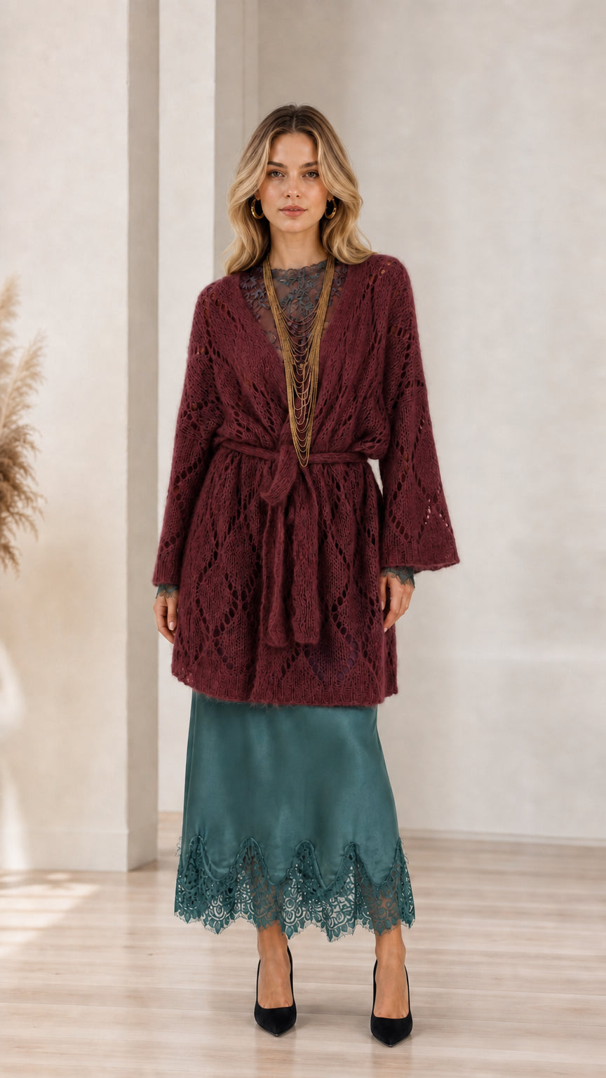 Model wearing burgundy open front knit cardigan with belt
