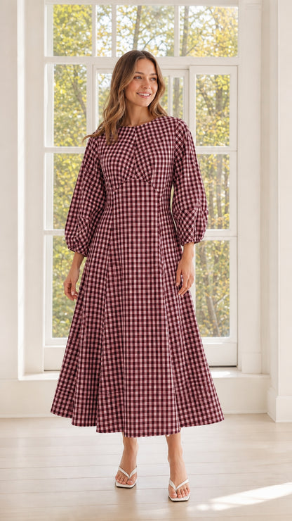 Woman wearing burgundy gingham midi dress
