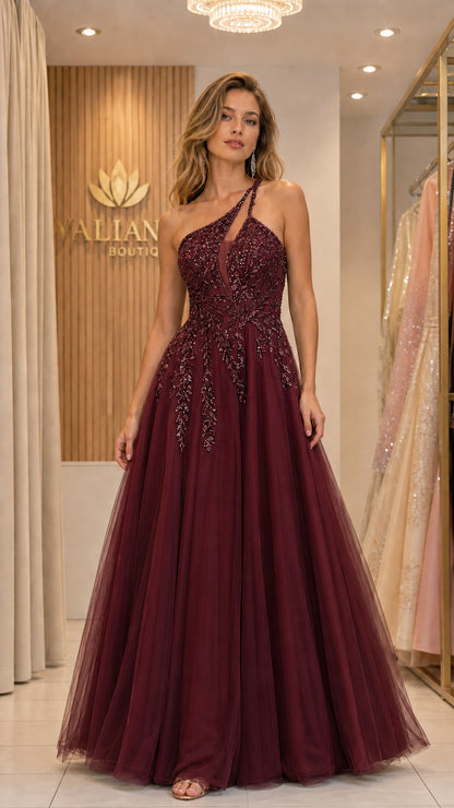 Front view of woman wearing burgundy one-shoulder beaded tulle evening gown