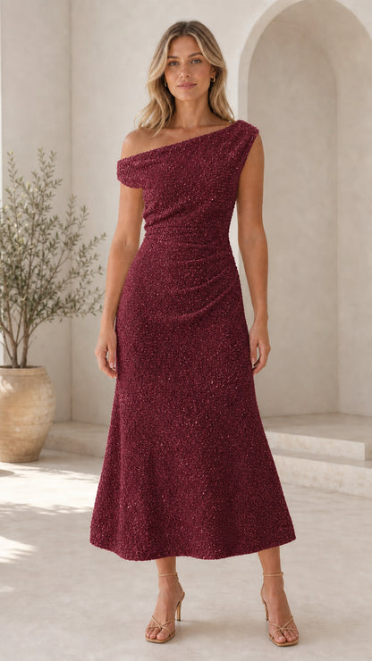 Front view of woman in burgundy one-shoulder midi dress