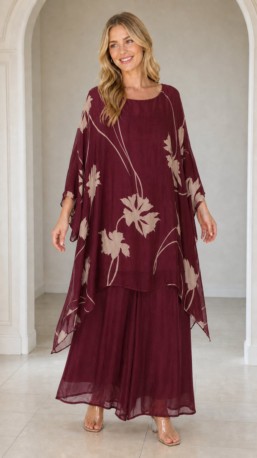 Front view of woman wearing burgundy floral kaftan set