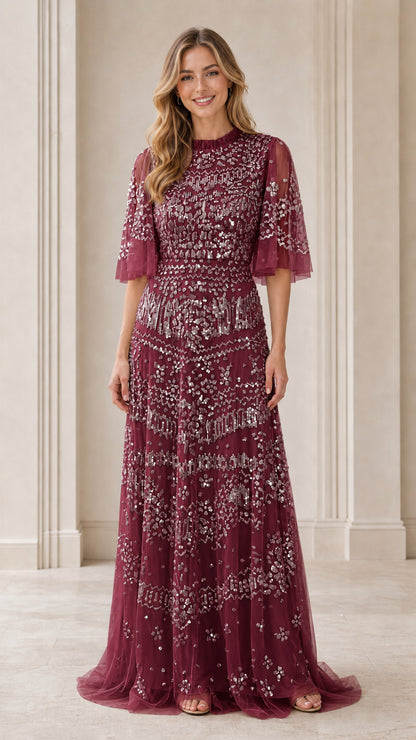 Front view of model wearing burgundy sequin evening gown