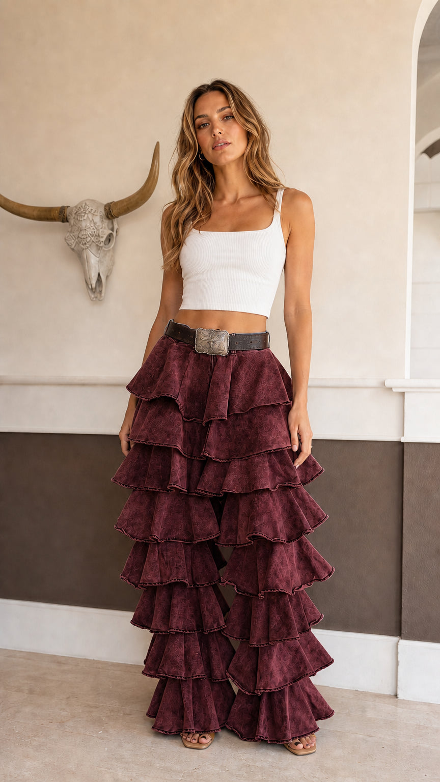 Model wearing burgundy washed tiered ruffle wide leg pants