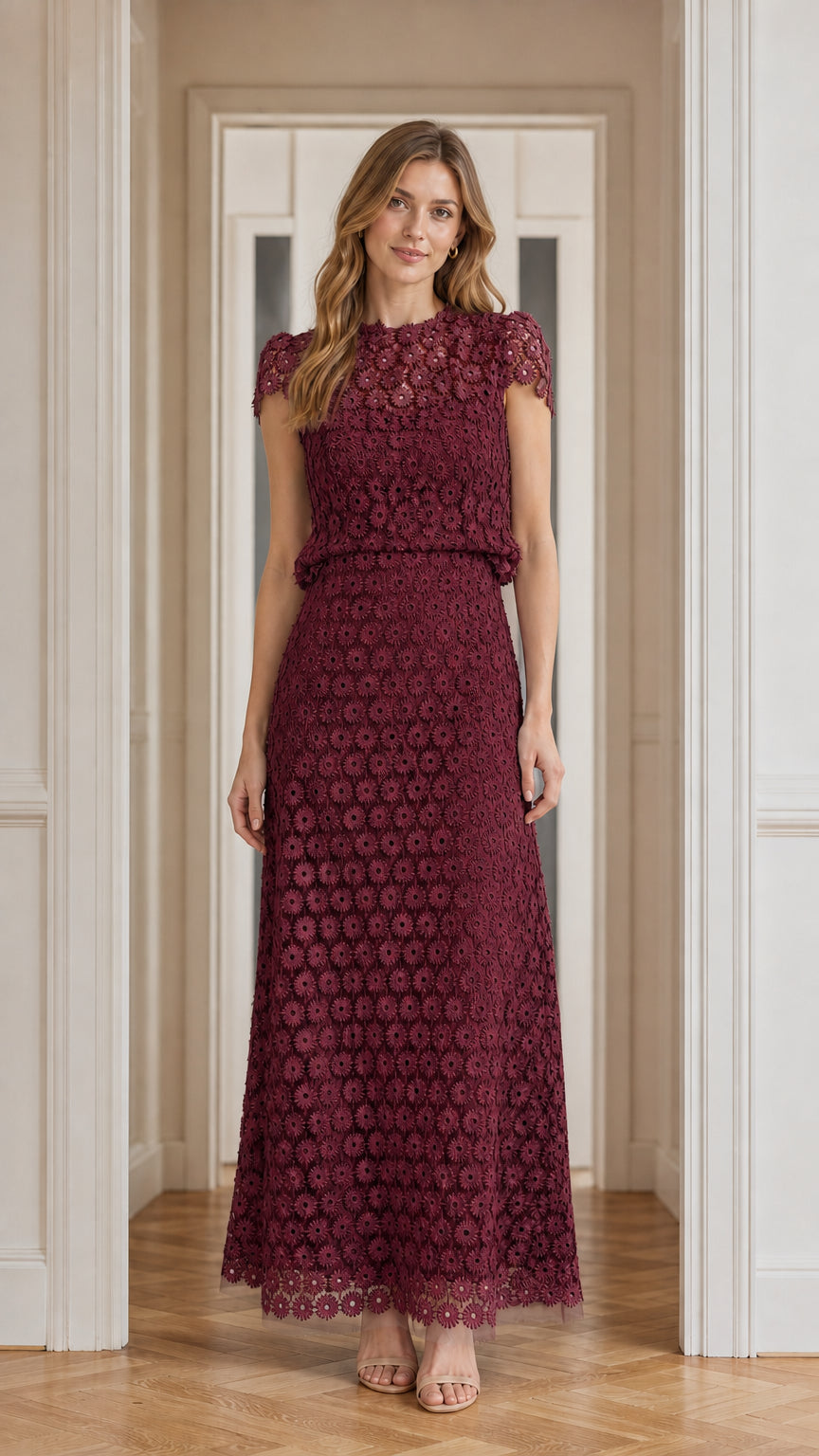 Model wearing burgundy floral lace maxi dress, front view