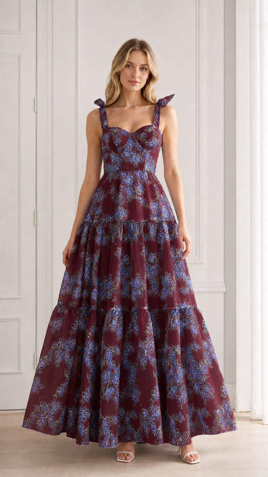 Model wearing burgundy floral tiered maxi dress