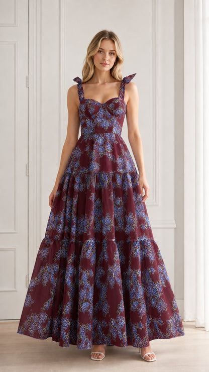 Model wearing burgundy floral tiered maxi dress