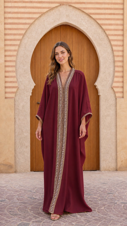 Front view of model wearing Burgundy pearl-trimmed maxi kaftan dress