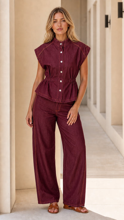 Model wearing burgundy denim matching set