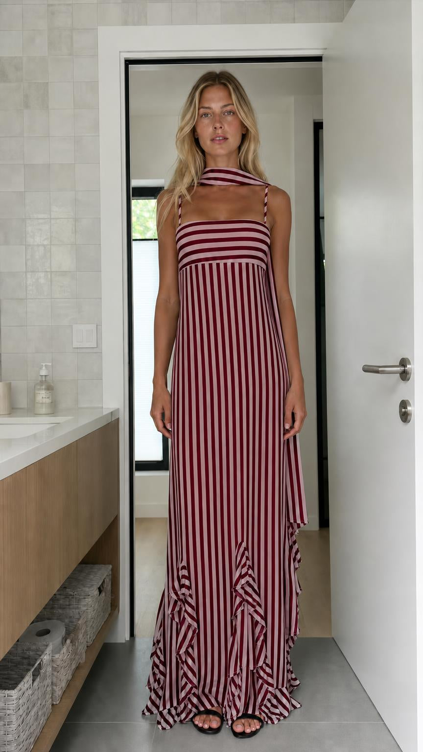 Model wearing burgundy and white striped maxi dress