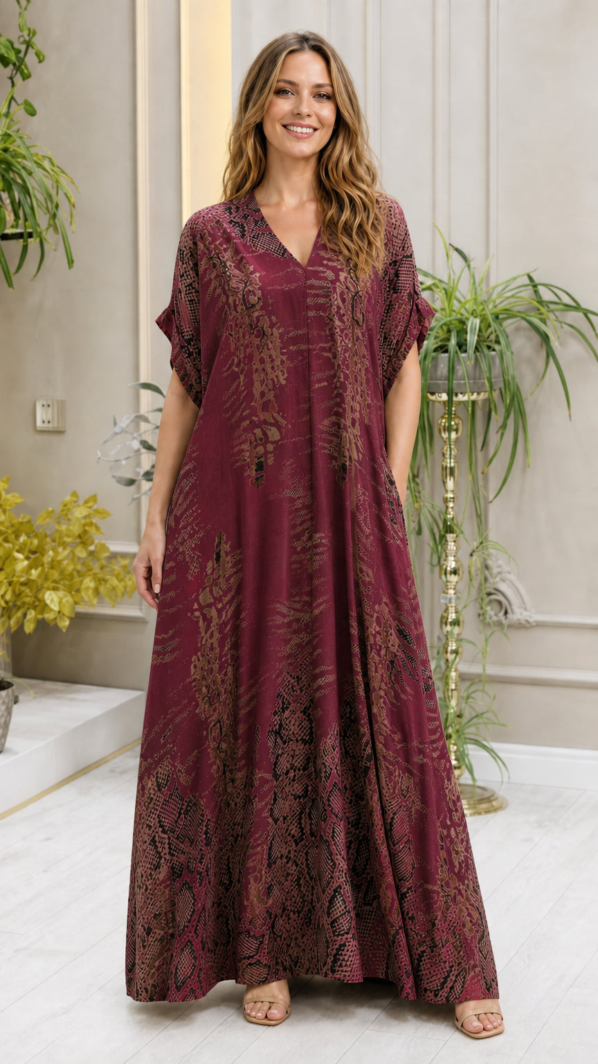 Model wearing burgundy animal print kaftan dress