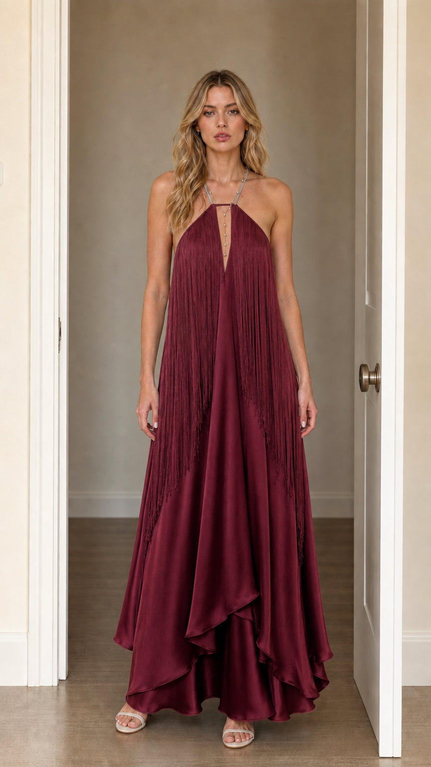 Front view of model wearing Burgundy halter fringe maxi dress