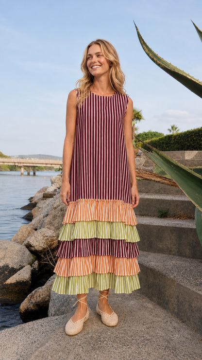 Model wearing burgundy striped tiered ruffle maxi dress