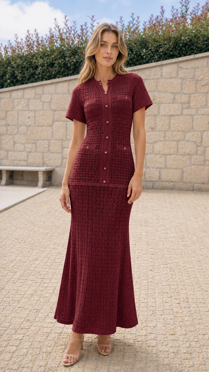 Model wearing burgundy textured knit top and maxi skirt matching set