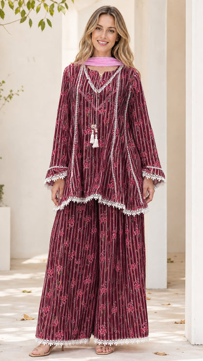 Model wearing maroon floral striped tunic and pants set