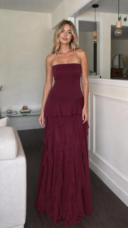 Front view of burgundy strapless ruffle tiered maxi dress