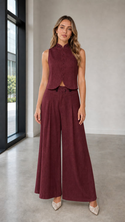 Full-body view of woman in burgundy two-piece set