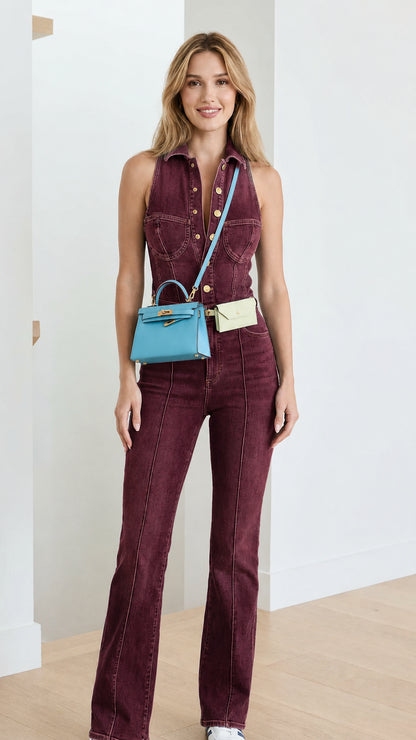 Model wearing burgundy denim flare jumpsuit