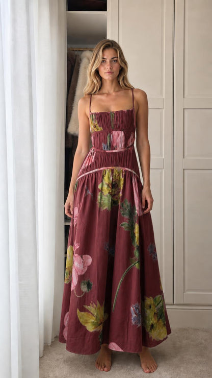 Model wearing burgundy floral print smocked maxi dress