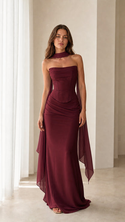 Model wearing the Burgundy strapless corset maxi gown