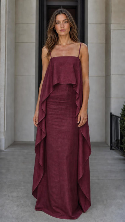 Model wearing the burgundy color variant of the flowing overlay maxi dress