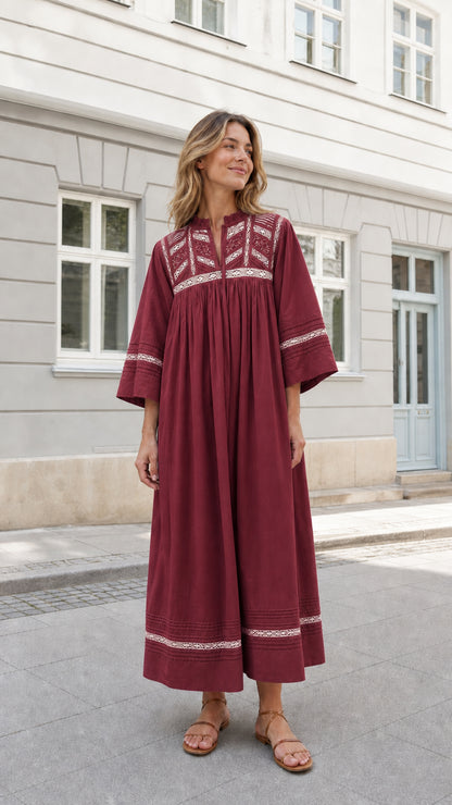 Woman wearing Burgundy wine red lace-accented bohemian maxi dress